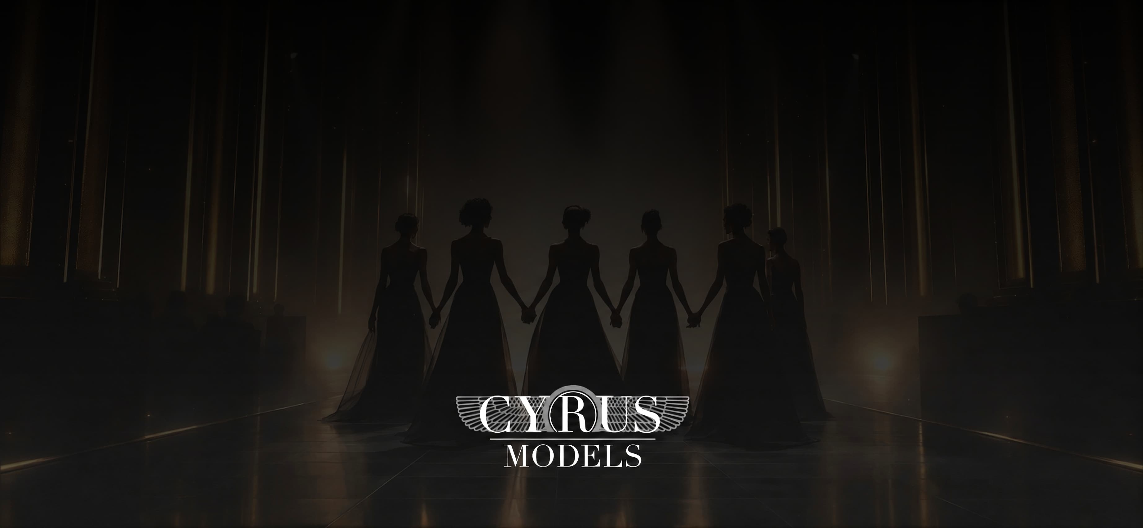 Models in black gowns holding hands backdrop